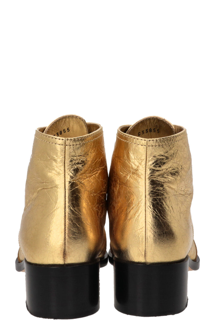 CHANEL CC Bottines à lacets en cuir doré et noir, veau doré