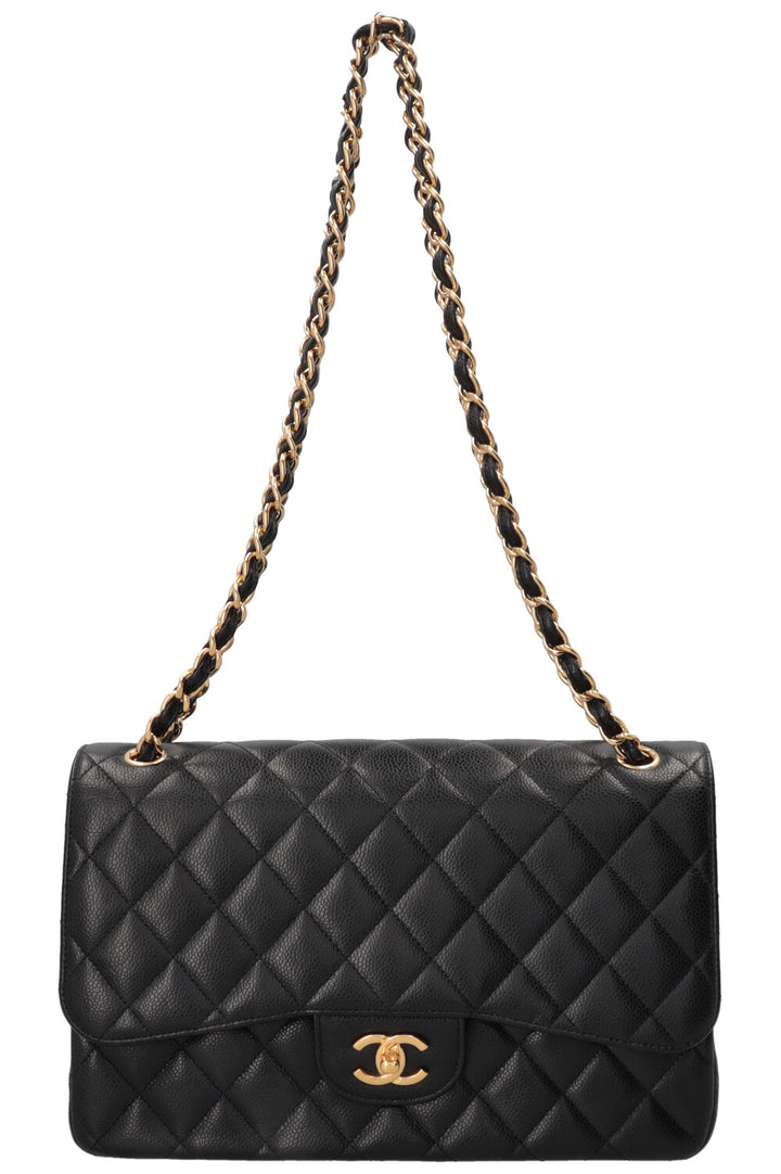 Sac à rabat doublé Chanel grand modèle en cuir caviar noir