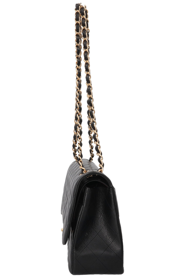 Sac à rabat doublé Chanel grand modèle en cuir caviar noir