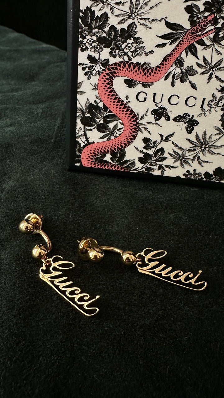 GUCCI Baule Script Drop Earrings Gold