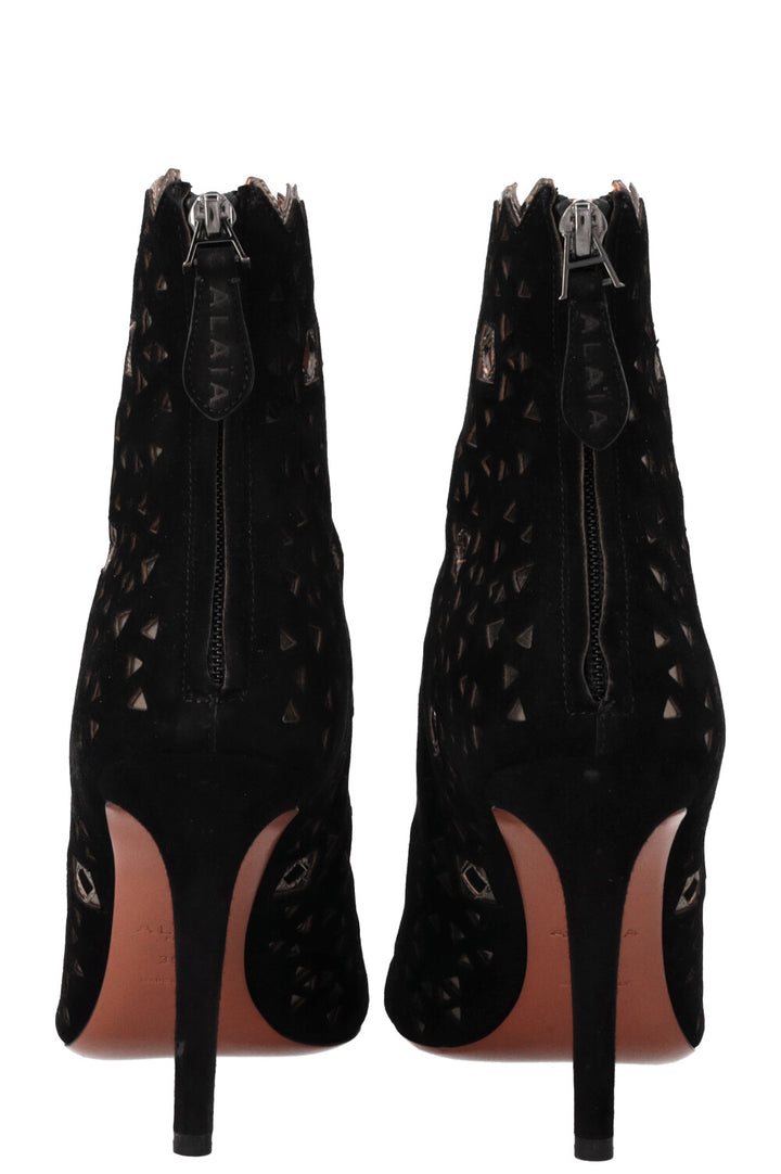 Bottines ALAIA découpées au laser en daim noir doré
