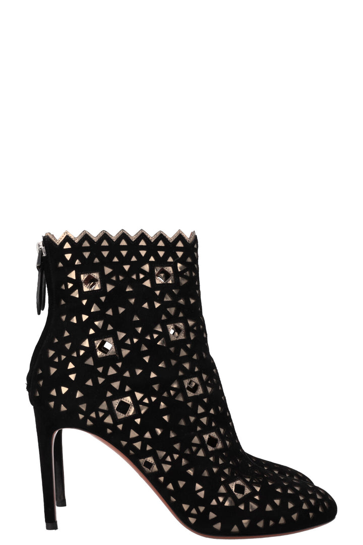 Bottines ALAIA découpées au laser en daim noir doré