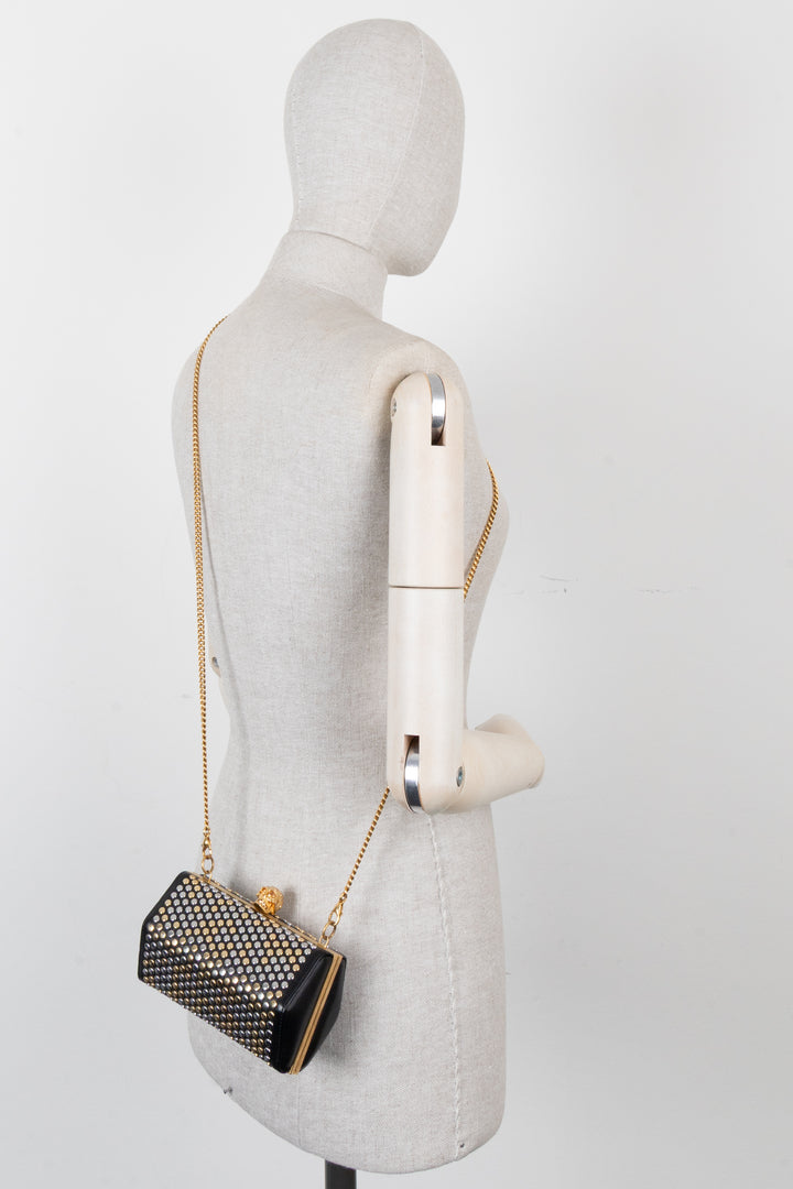 Pochette cloutée ALEXANDER MCQUEEN en cuir noir, or et argent