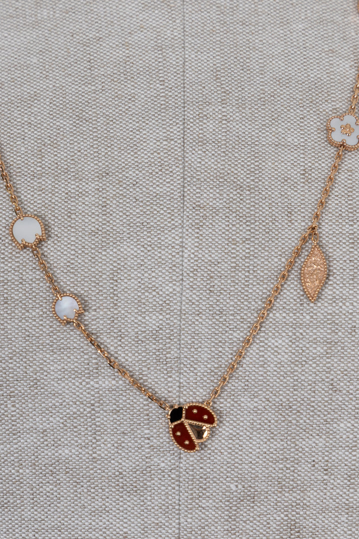 VAN CLEEF & ARPELS Collier long Lucky Spring 15 motifs, or rose 18 carats Or rose