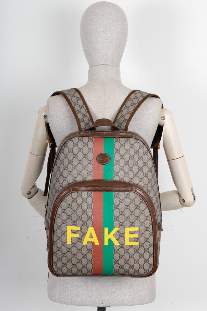 GUCCI GG Fake/Not Backpack Supreme Canvas Brown