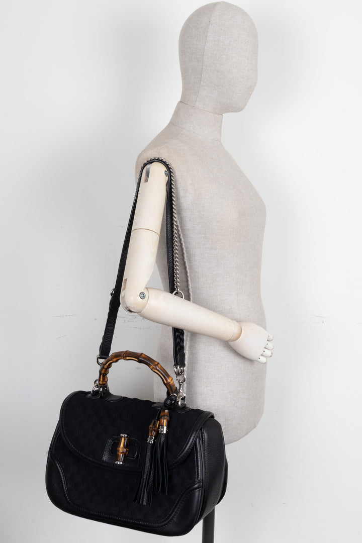 Sac GUCCI 1947 en néoprène avec anse en bambou et motif GG noir