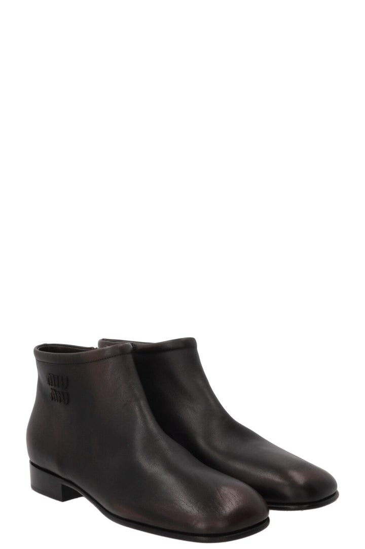 Boots à logo MIU MIU en cuir marron