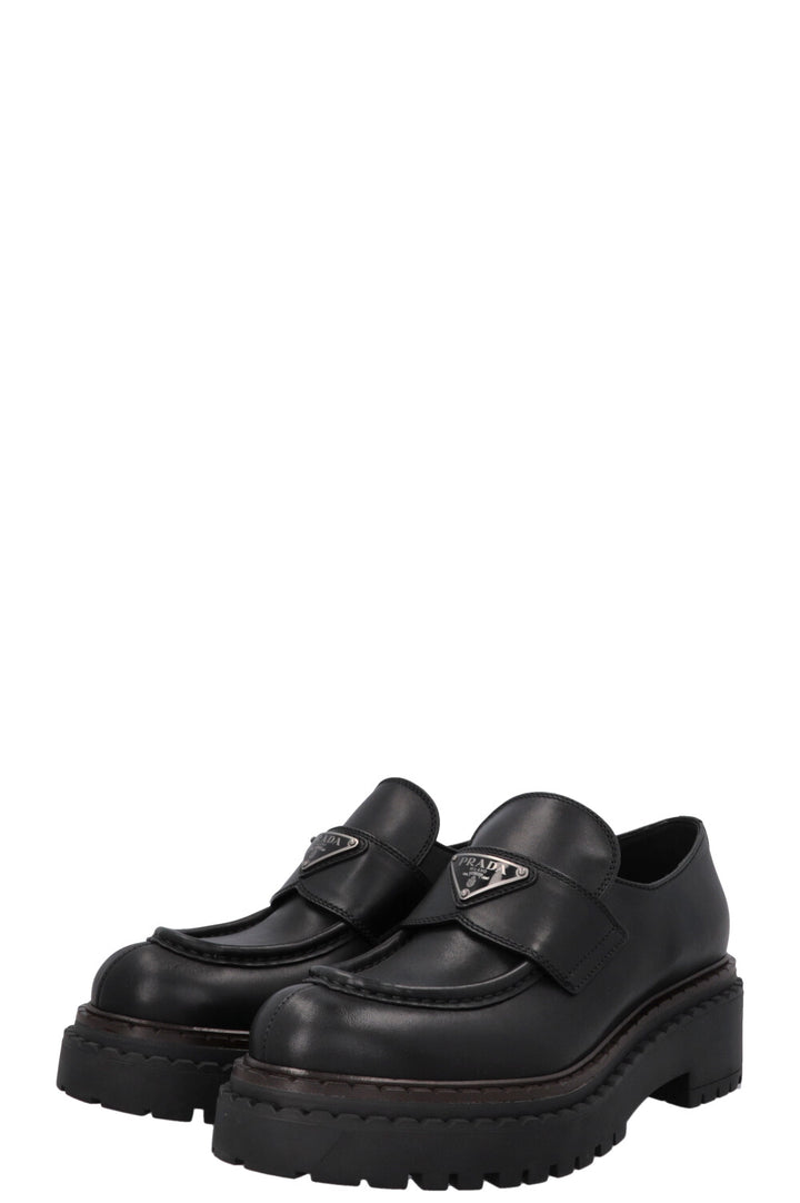 Mocassins PRADA à logo triangulaire noirs