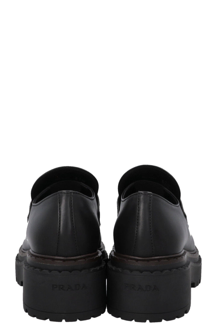 Mocassins PRADA à logo triangulaire noirs