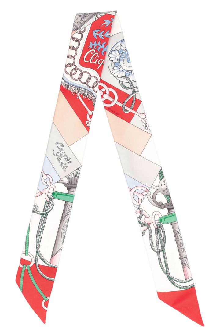 HERMÈS Cliquets Twilly en soie blanche et rouge