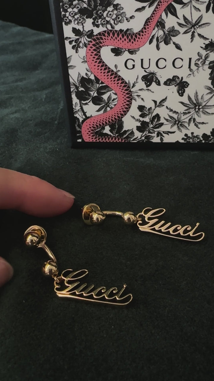 GUCCI Baule Script Drop Earrings Gold